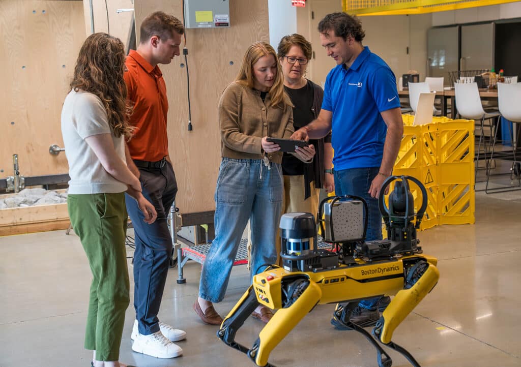 Learners are guided through operating Spot by a Boston Dynamics trainer