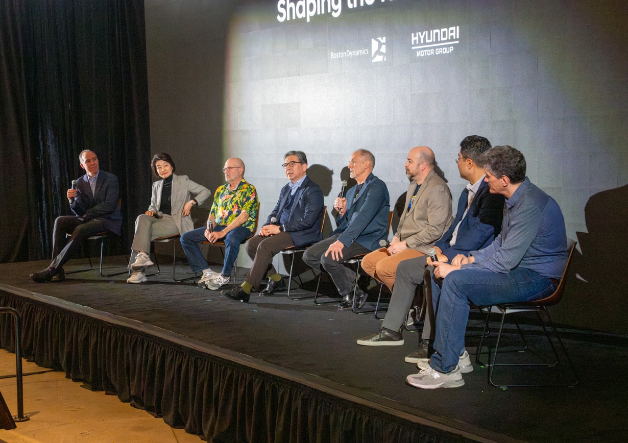 A panel of Boston Dynamics and Hyundai executives at a town hall meeting in BD headquarters