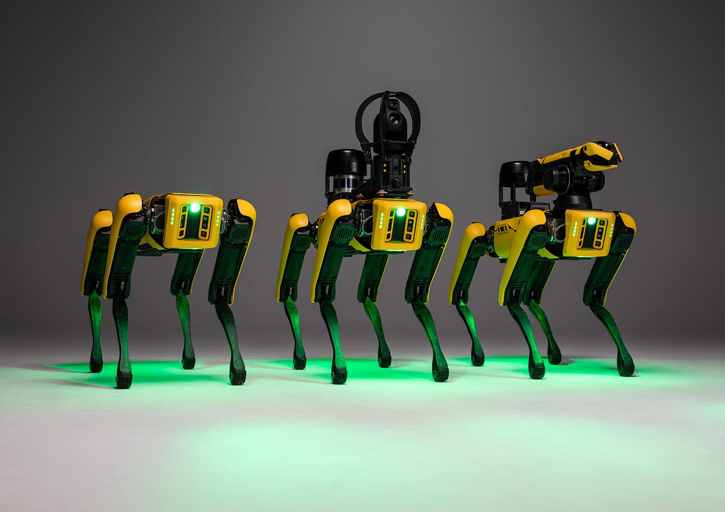 3 Spot robots with different sets of sensing and manipulation payloads