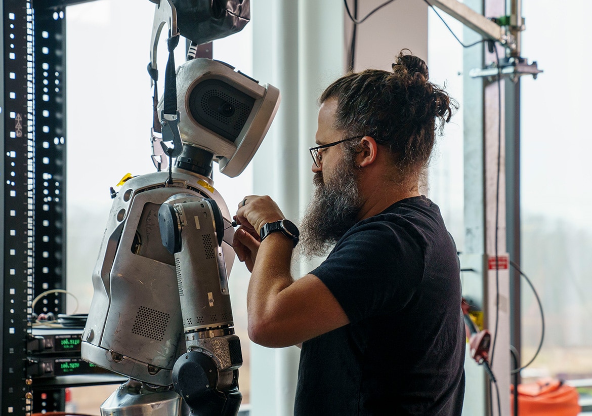 an engineer works on the atlas robot